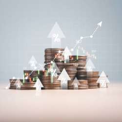 Heap of coins money with up arrow and stock market chart for financial banking increase interest rate or mortgage investment dividend from business growth concept.